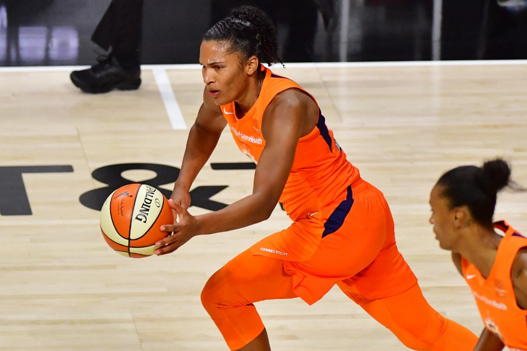 Alyssa Thomas of the Connecticut Sun dribbles against Las Vegas Aces..