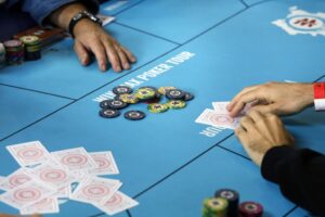 poker table with players around it