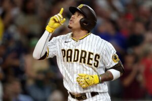 Manny Machado #13 of the San Diego Padres reacts after connecting for a solo homerun against the Washington Nationals.