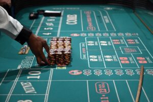 Craps Dealer Prepares Stacks Casino Chips