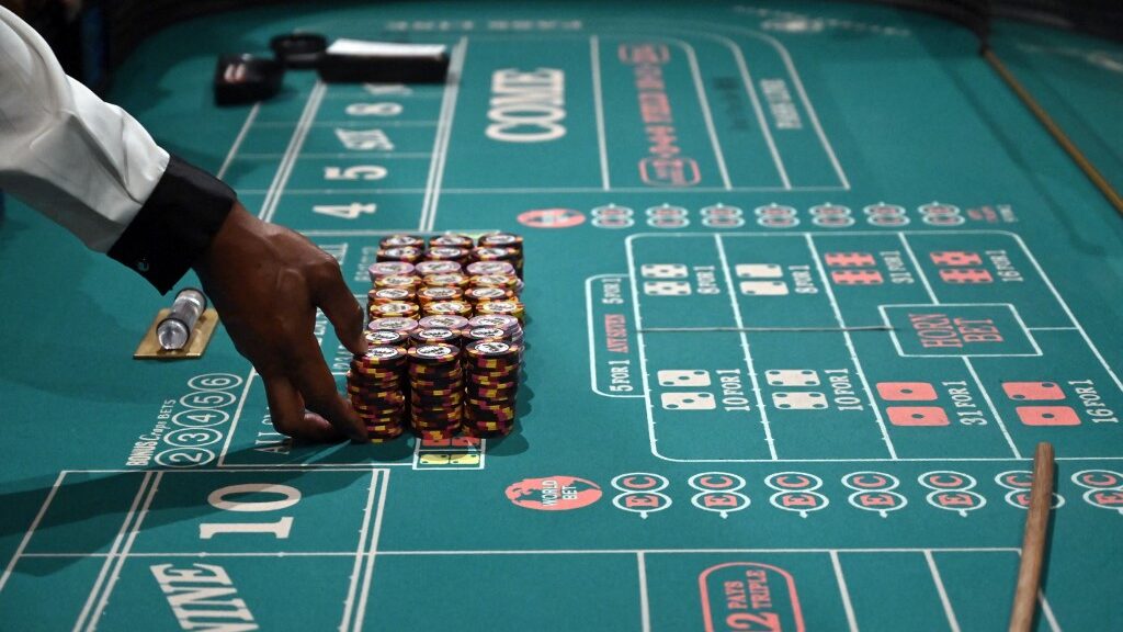 craps-dealer-prepares-stacks-casino-chips-aspect-ratio-16-9