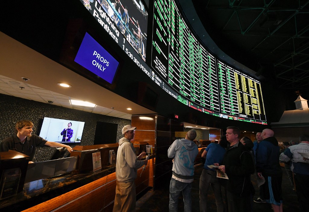 Bettors line up to place wagers at a sportsbook in Las Vegas.