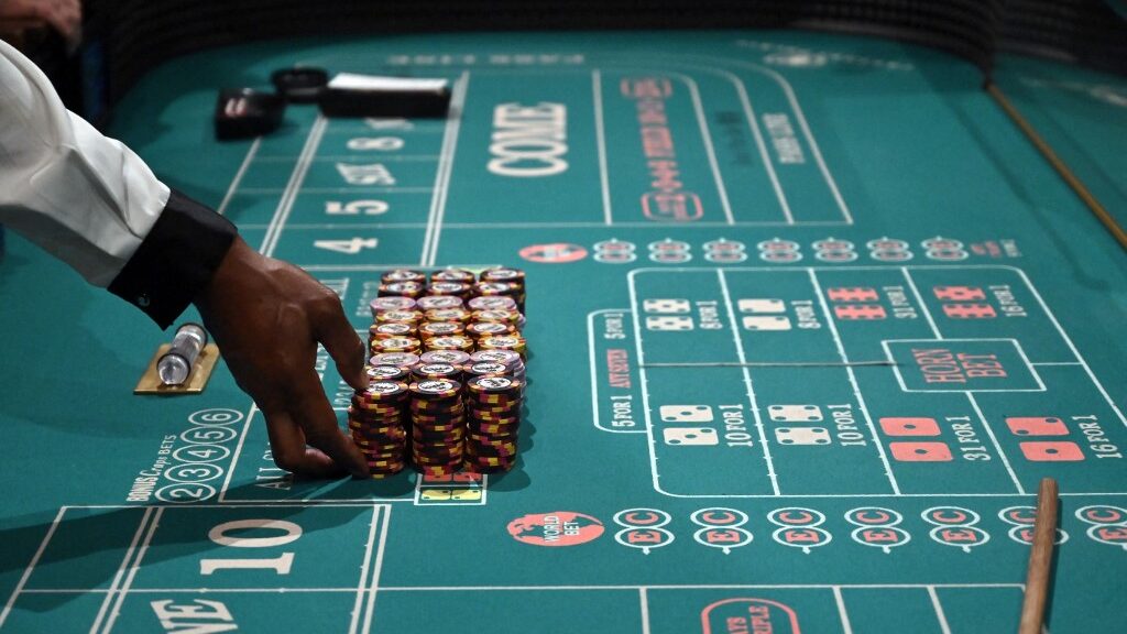 craps-dealer-prepares-stacks-casino-chips-aspect-ratio-16-9