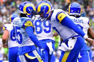Tutu Atwell #15 of the Los Angeles Rams celebrates with teammates after scoring a touchdown against the Seattle Seahawks.
