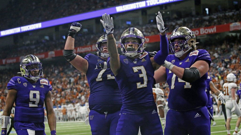 Taj-Davis-3-of-the-Washington-Huskies-celebrates-his-touchdown-reception-against-the-Texas-Longhorns-aspect-ratio-16-9