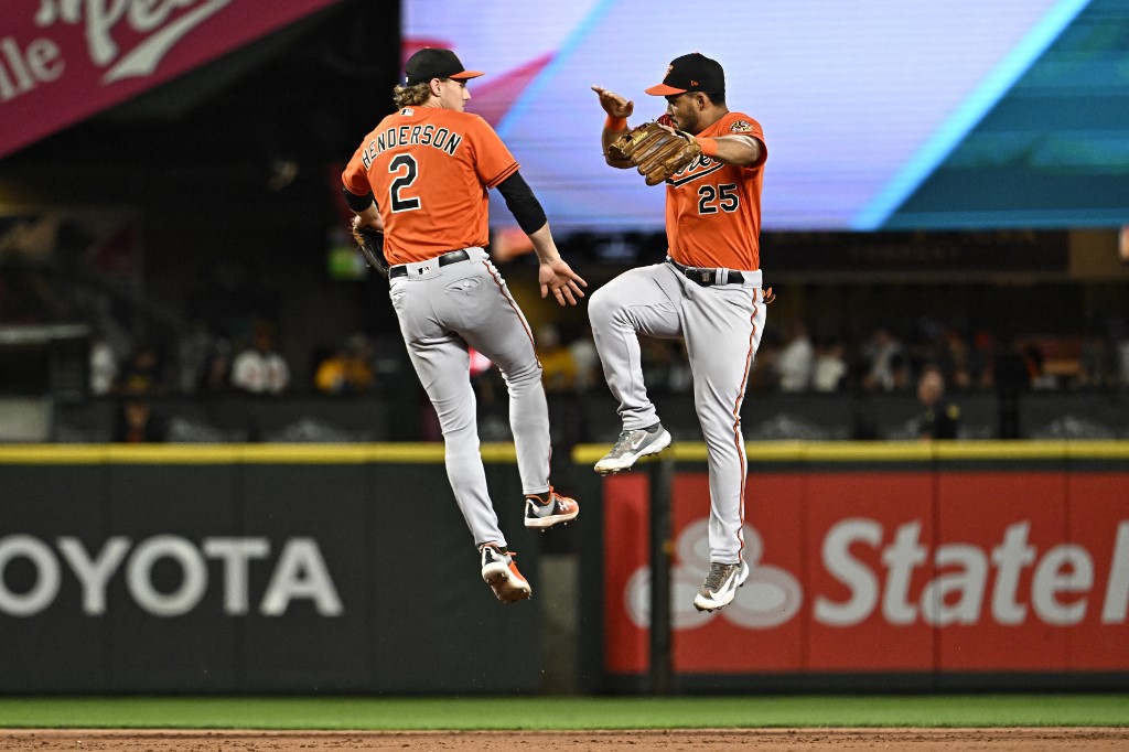 Felix Bautista celebrates with Adley Rutschman of the Baltimore