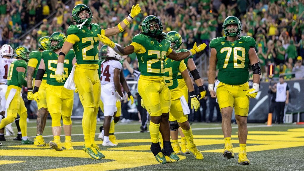 Running-back-Jordan-James-20-of-the-Oregon-Ducks-celebrities-his-touchdown-against-the-Stanford-Cardinal-aspect-ratio-16-9