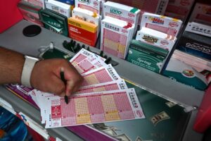 Person Fills in Powerball Lottery Tickets