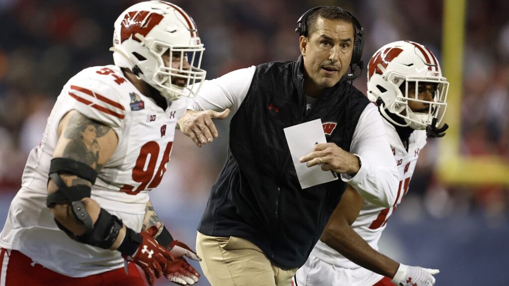Head-coach-Luke-Fickell-of-the-Wisconsin-Badgers-runs-onto-the-field-to-call-a-time-out-aspect-ratio-16-9