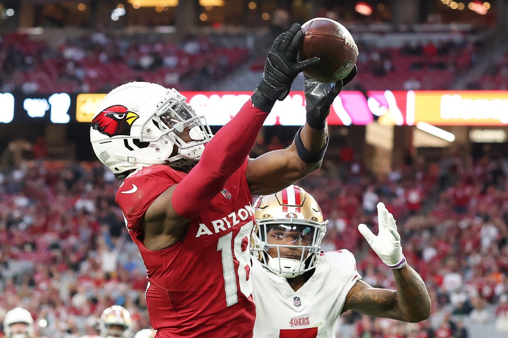 Marvin Harrison Jr. #18 of the Arizona Cardinals catches a touchdown pass against the San Francisco 49ers
