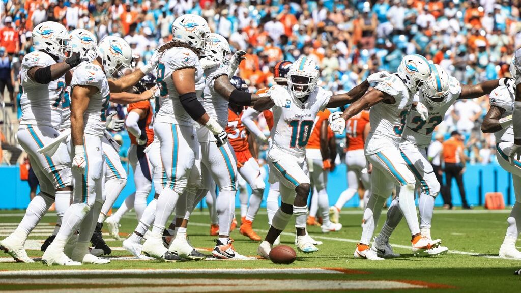 Tyreek-Hill-10-of-the-Miami-Dolphins-and-Raheem-Mostert-31-celebrate-with-teammates-after-Mosterts-rushing-touchdown-against-the-Denver-Broncos-aspect-ratio-16-9