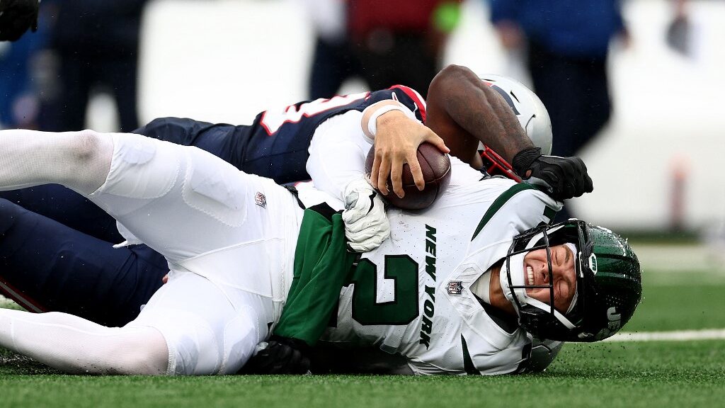 Zach-Wilson-2-of-the-New-York-Jets-is-sacked-by-Anfernee-Jennings-33-of-the-New-England-Patriots-aspect-ratio-16-9