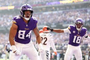 Josh Oliver #84 of the Minnesota Vikings celebrates after scoring a touchdown against the Cincinnati Bengals