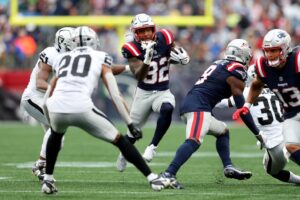 TreVeyon Henderson #32 of the New England Patriots runs with the ball during the game against the Las Vegas Raiders