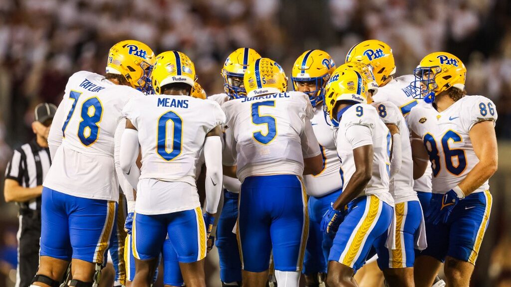 Members-of-the-Pittsburgh-Panthers-huddle-in-the-first-half-against-the-Virginia-Tech-Hokies-aspect-ratio-16-9