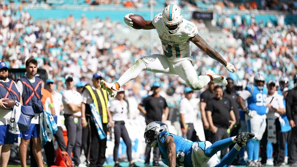 Raheem-Mostert-31-of-the-Miami-Dolphins-jumps-over-CJ-Henderson-23-of-the-Carolina-Panthers-aspect-ratio-16-9