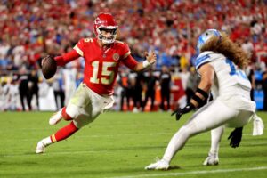 Quarterback Patrick Mahomes #15 of the Kansas City Chiefs scrambles during the game against the Detroit Lions