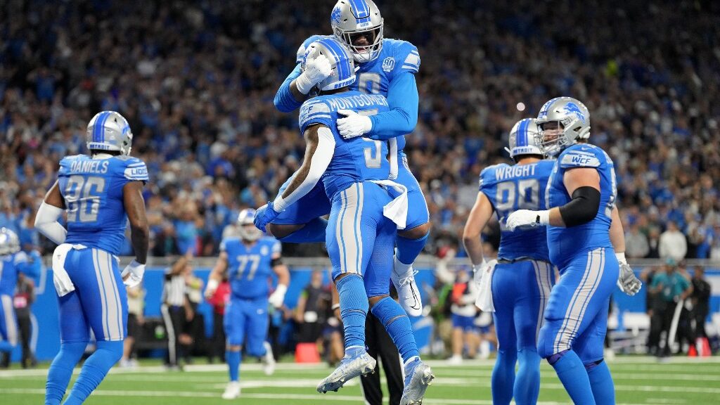 David-Montgomery-5-and-Penei-Sewell-58-of-the-Detroit-Lions-celebrate-after-Montgomery-scored-a-touchdown-in-the-first-quarter-against-the-Carolina-Panthers-at-Ford-Field-aspect-ratio-16-9