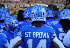 Amon-Ra St. Brown of the Detroit Lions, a player with great value for NFL player props week 10, waits to take the field against the Minnesota Vikings.