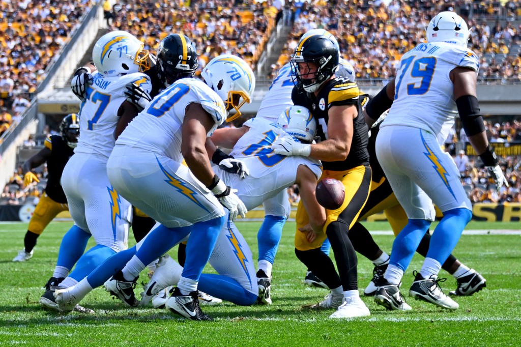 Nick Herbig #51 of the Pittsburgh Steelers forces a fumble against quarterback Justin Herbert #10 of the Los Angeles Chargers. Steelers-Chargers is one of the matchups featured in our NFL picks week 10.