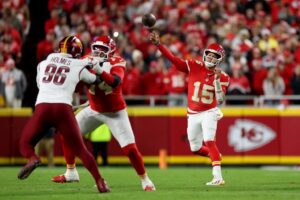 Patrick Mahomes #15 of the Kansas City Chiefs throws a pass against the Washington Commanders