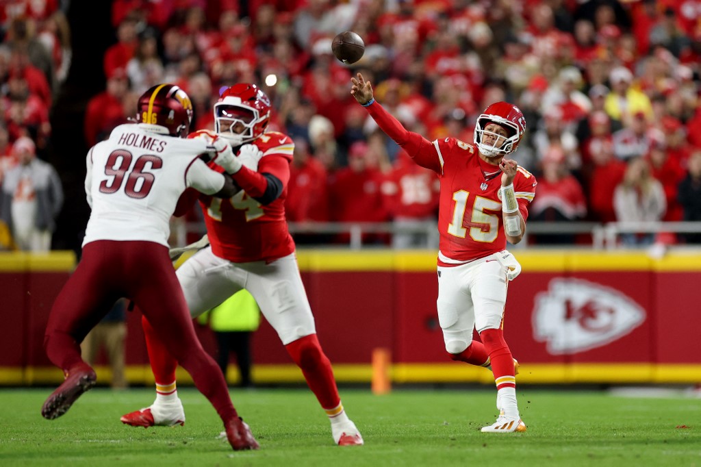 Patrick Mahomes #15 of the Kansas City Chiefs throws a pass against the Washington Commanders