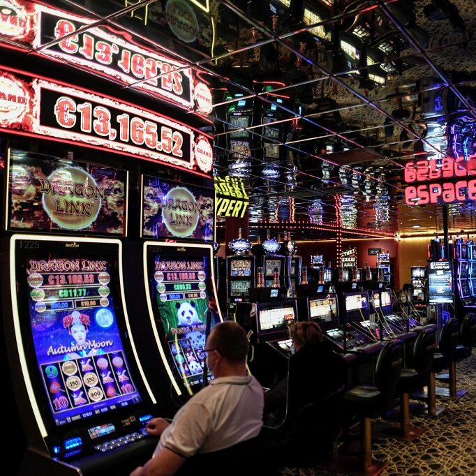 general-view-people-gambling-slot-machines-aspect-ratio-1-1