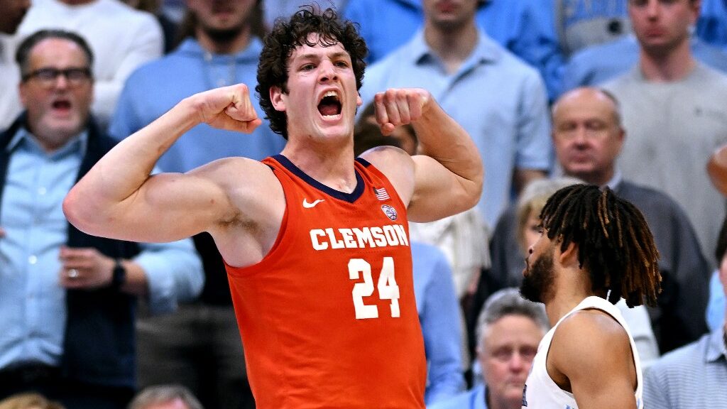 PJ-Hall-24-of-the-Clemson-Tigers-reacts-after-drawing-a-foul-against-RJ-Davis-4-of-the-North-Carolina-Tar-Heels-during-the-second-half-aspect-ratio-16-9