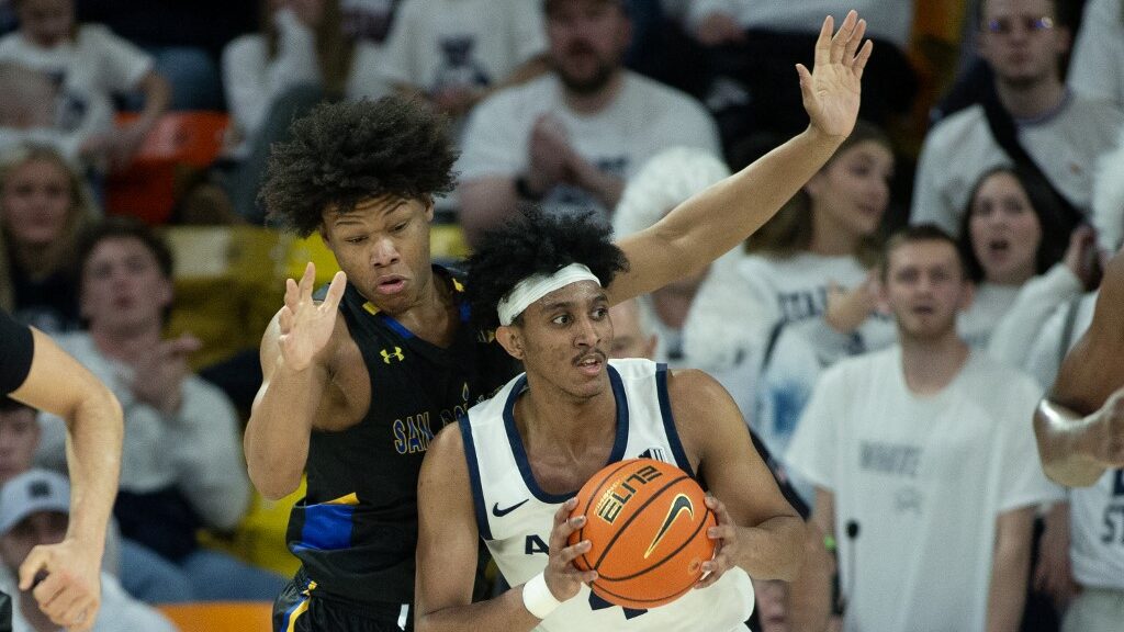 Ian-Martinez-4-of-the-Utah-State-Aggies-is-pressured-by-Christian-Wise-20-of-the-San-Jose-State-Spartans-during-the-second-half-at-the-Dee-Glen-Spectrum-on-January-30-2024-aspect-ratio-16-9