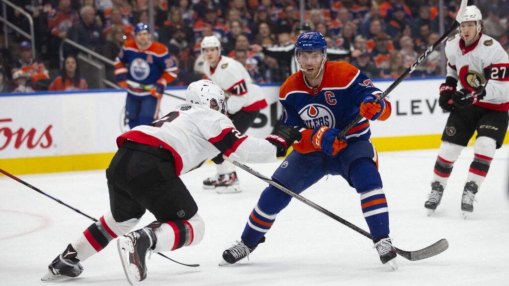 Connor-McDavid-97-of-the-Edmonton-Oilers-is-defended-against-by-Artem-Zub-2-of-the-Ottawa-Senators-during-the-first-period-at-Rogers-Place-on-January-6-2024-aspect-ratio-16-9