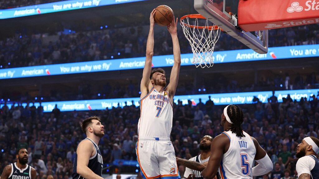 Chet-Holmgren-7-of-the-Oklahoma-City-Thunder-reaches-for-a-dunk-between-Luka-Doncic-77-and-Derrick-Jones-Jr.-55-of-the-Dallas-Mavericks-during-the-first-quarter-in-Game-3-aspect-ratio-16-9