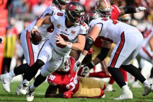 Baker Mayfield #6 of the Tampa Bay Buccaneers carries the ball against the San Francisco 49ers