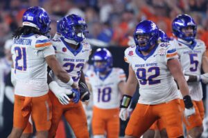 Seyi Oladipo #23 of the Boise State Broncos celebrates with teammates after recovering a fumble by Drew Allar #15 of the Penn State Nittany Lions.