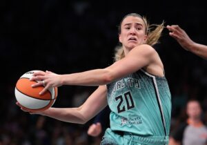 Sabrina Ionescu #20 of the New York Liberty drives against the Indiana Fever.