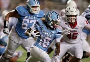 Jeremiah Williams #19 of the Rice Owls runs with the ball during the game against the Houston Cougars