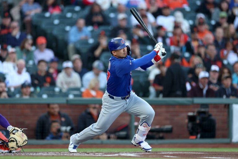 Seiya Suzuki #27 of the Chicago Cubs hits a single against the San Francisco Giants.