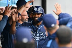 Junior Caminero #13 of the Tampa Bay Rays celebrates against the Cleveland Guardians.