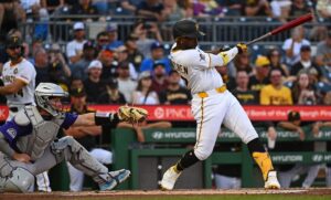 Andrew McCutchen #22 of the Pittsburgh Pirates hits a two run home run against the Colorado Rockies.