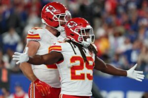 Kareem Hunt #29 of the Kansas City Chiefs celebrates a touchdown with Travis Kelce #87 against the New York Giants
