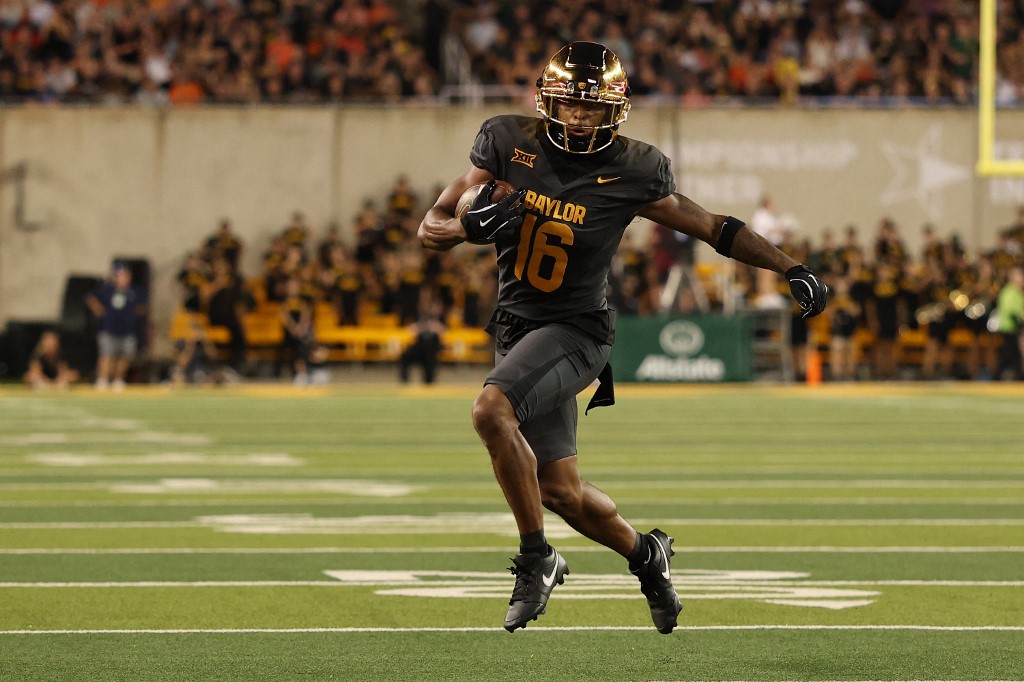 Kobe Prentice #16 of the Baylor Bears runs for yards during a game against the Auburn Tigers.
