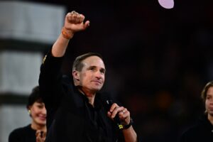 Former player Drew Brees celebrates as he is inducted into the New Orleans Saints Hall of Fame.