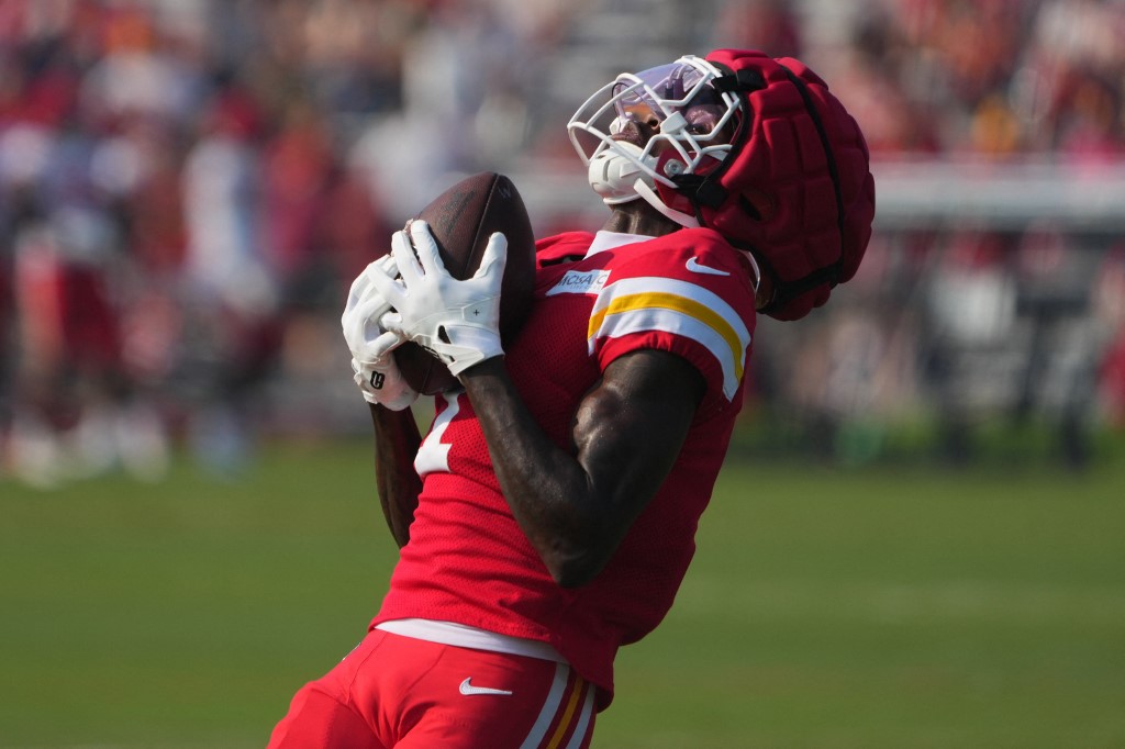 Xavier Worthy #1 of the Kansas City Chiefs catches a pass during training camp.