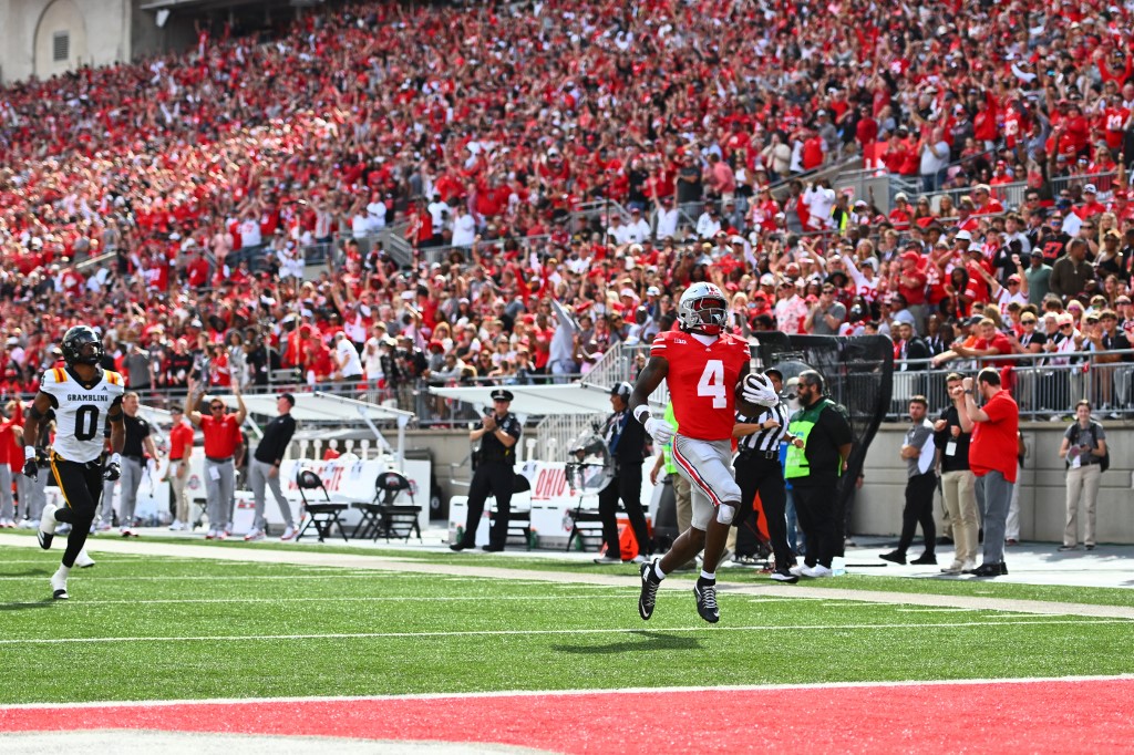 Jeremiah Smith #4 of the Ohio State Buckeyes runs for a touchdown in the first quarter of a game against the Grambling State Tigers