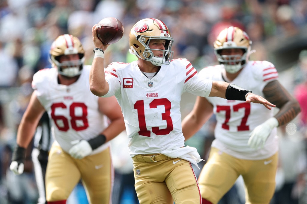 Brock Purdy #13 of the San Francisco 49ers looks to pass against the Seattle Seahawks
