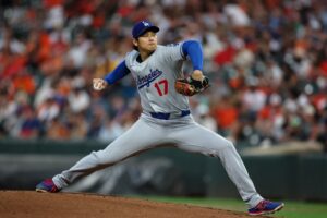 Shohei Ohtani #17 of the Los Angeles Dodgers pitches against the Baltimore Orioles