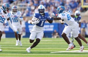 Kendrick Law #1 of Kentucky Wildcats runs with the ball against the Ole Miss Rebels