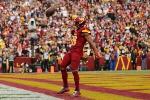Jeremy McNichols #26 of the Washington Commanders celebrates after a rushing touchdown against the Pittsburgh Steelers