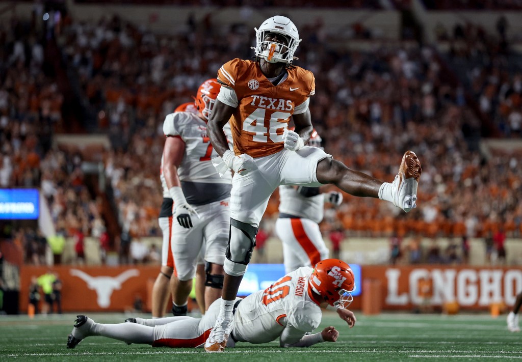 Smith Orogbo #46 of the Texas Longhorns celebrates after sacking Hunter Watson #10 of the Sam Houston State Bearkats