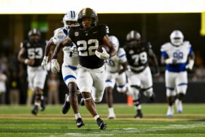 Makhilyn Young #22 of the Vanderbilt Commodores runs the ball against the Georgia State Panthers