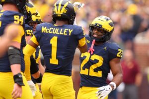 Justice Haynes #22 and Donaven McCulley #1 of the Michigan Wolverines celebrates against the Central Michigan Chippewas